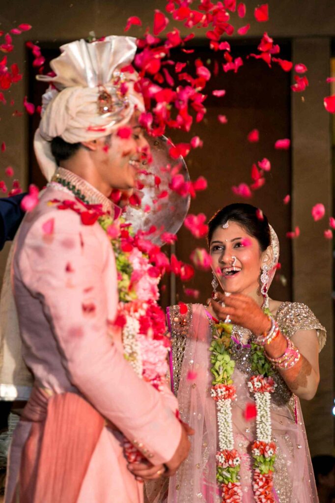 Bride Showering the Groom with Flowers